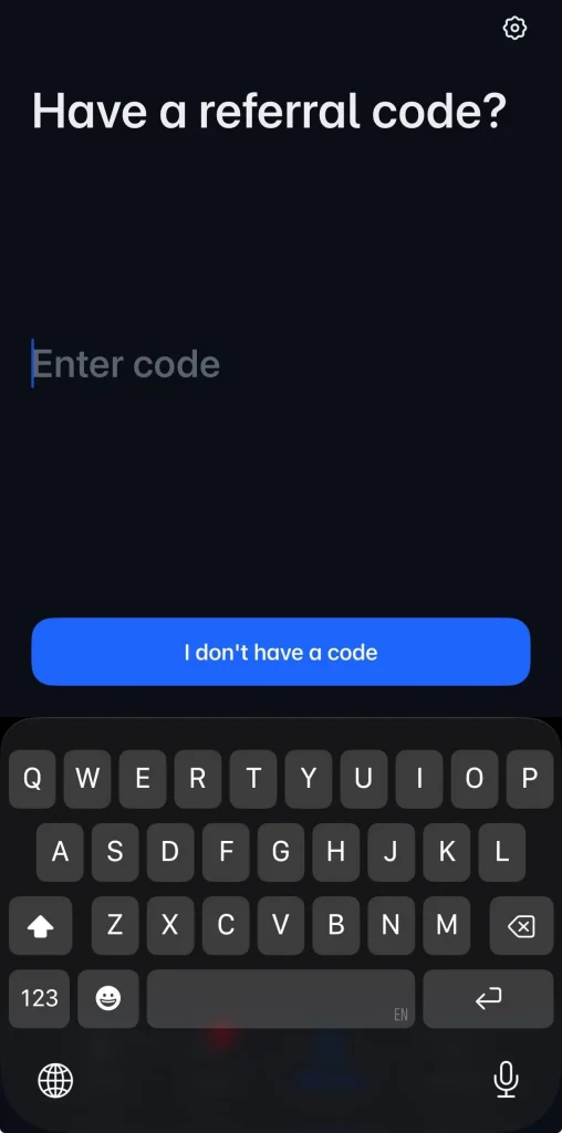 Polymarket mobile app referral code screen showing field to enter a referral code or continue without one during registration.
